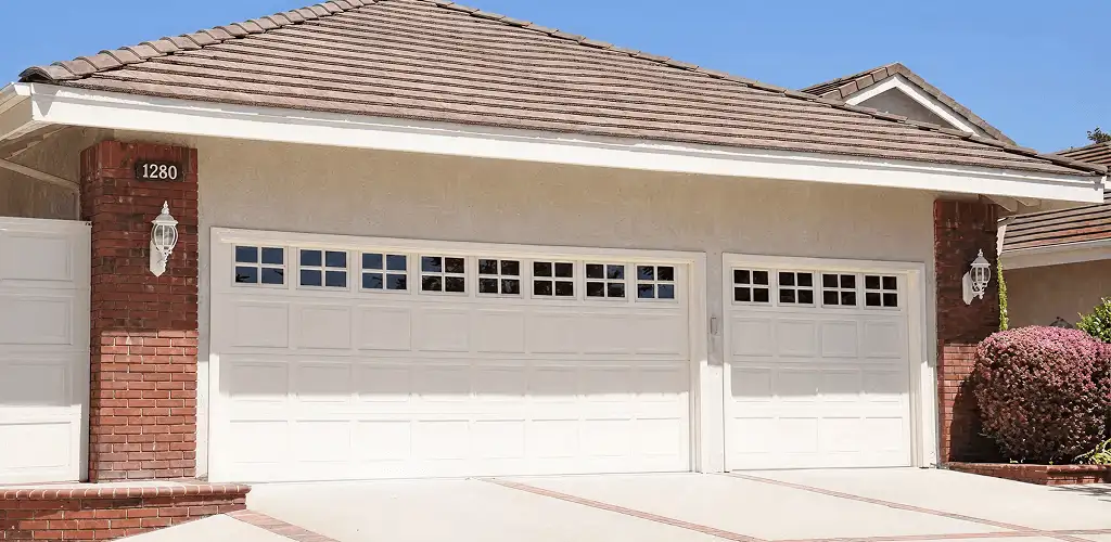 Residential garage door repair service for a double garage door in Jersey City, NJ
