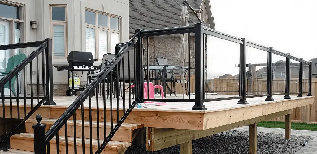 Handrail installation on a deck staircase for safety and code compliance in Jersey City, NJ