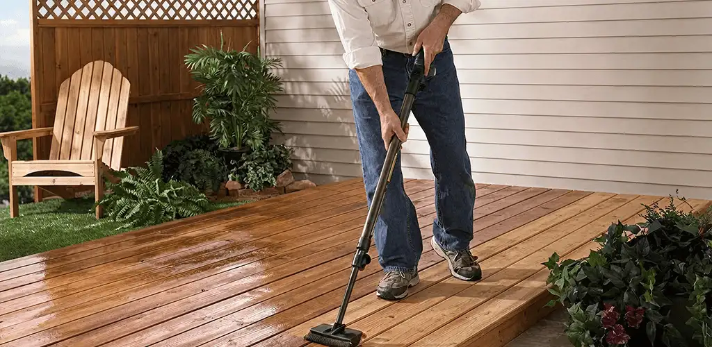 Deck staining service applying stain to a backyard wood deck in Jersey City, NJ